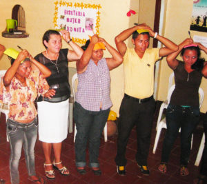 Community leader Doña Adilia (2nd from left) facilitating a community workshop